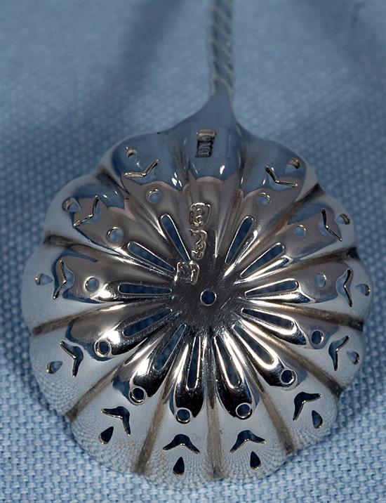 An early Victorian silver fiddle pattern sifter spoon, by John Harris IV & 2 others, 111 grams.